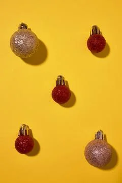 Red christmas ball patterns on solid blue background. Balls of different text Stock Photos