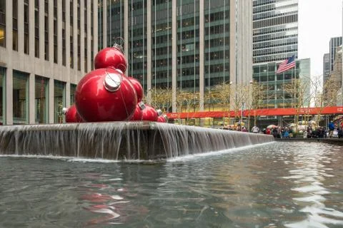Red christmas balls decorating the front of a building in New York City Stock Photos