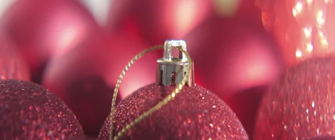 Red Christmas balls with golden string 4K scope video Stock Footage 317075733