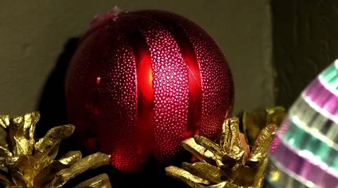 Red Christmas ballwith pine cones close-up in the corner Stock Footage 68659346