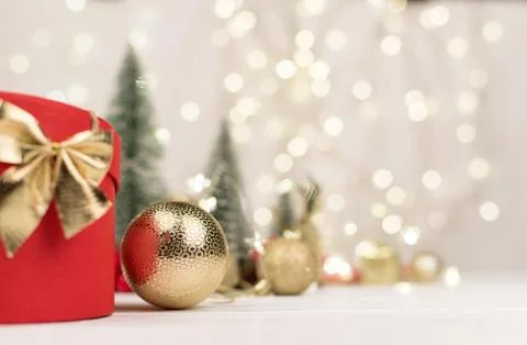Red Christmas gift box with a gold bow on the background of bokeh, Christmas  Stock Photos