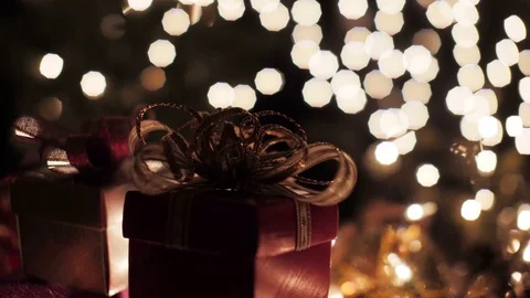 Red Christmas gift boxes with glow bokeh lights background Stock Footage 80815868