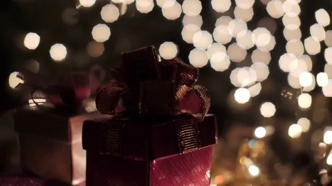 Red Christmas gift boxes with glow bokeh lights background Stock Footage 81405683