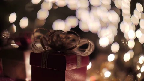 Red Christmas gift boxes with glow bokeh lights background Stock Footage 81414098