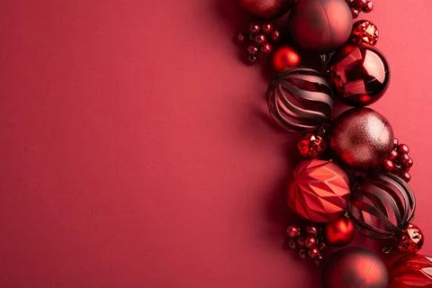 Red Christmas ornaments border on a solid background Stock Photos