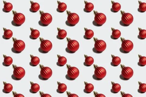 Red Christmas ornaments pattern of different size Stock Photos