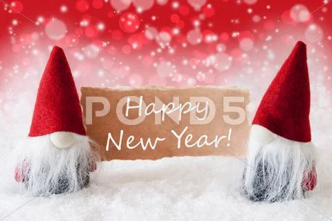 Red Christmassy Gnomes With Card, Text Happy New Year Stock Photos