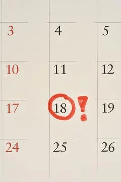 Red circle and exclamation mark on calendar date eighteen Stock Photos