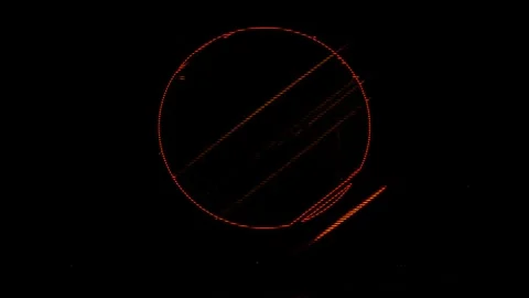 Red circular pattern with diagonal lines on a black background Stock Footage 284246375