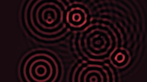 Red circular patterns move in waves on a dark background Stock Footage 338224255