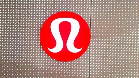 Red circular sign on a patterned metal wall Stock Photos