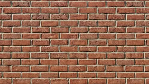 Red clay brick wall surface texture as background image, old tiles, masonry. Stock Photos