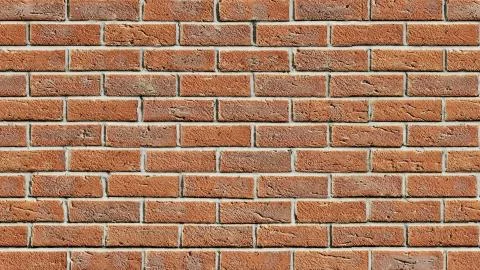 Red clay brick wall surface texture as background image, old tiles, masonry. Stock Photos