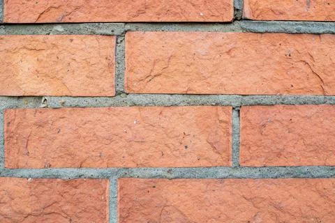 Red clay brick wall texture with grey cement joints, detailed solid buildin.. Foto stock