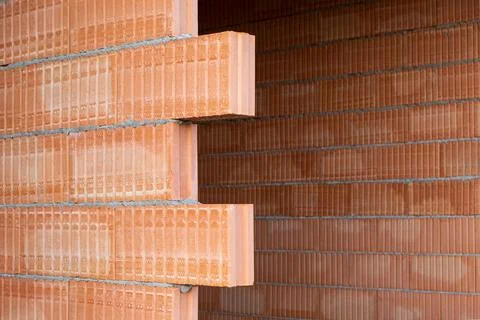 Red clay Ceramic Thermo Bricks construction material. Construction site wit.. 写真素材