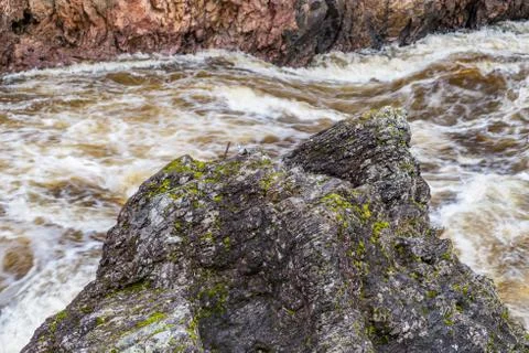 Red cliff, stone wall, forest, waterfall and wild river view in autumn. Fall  Stock Photos