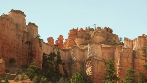 Red cliffs and hoodoos at the Moss cave trail at Bryce Canyon Stock Footage 214384738