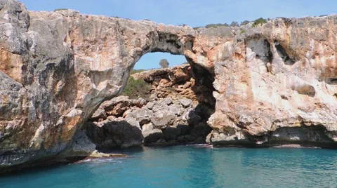 Red Cliffs With Cave Seen From A Boat In The Sea Stock Footage 49882326