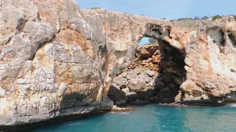 Red Cliffs, Caves, Small Bays And Emerald Sea Stock Footage 49882327