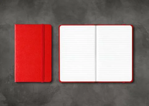 Red closed and open lined notebooks on dark concrete background Stock Photos