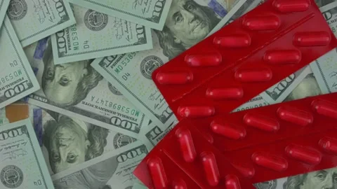 Red closed blister pack with pills rotate on us dollars background. Stock Footage 168198612