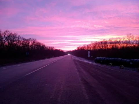 Red clouds and road Foto stock