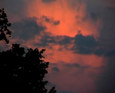 Red clouds in the blue sky at sunset Stock Footage 25364696