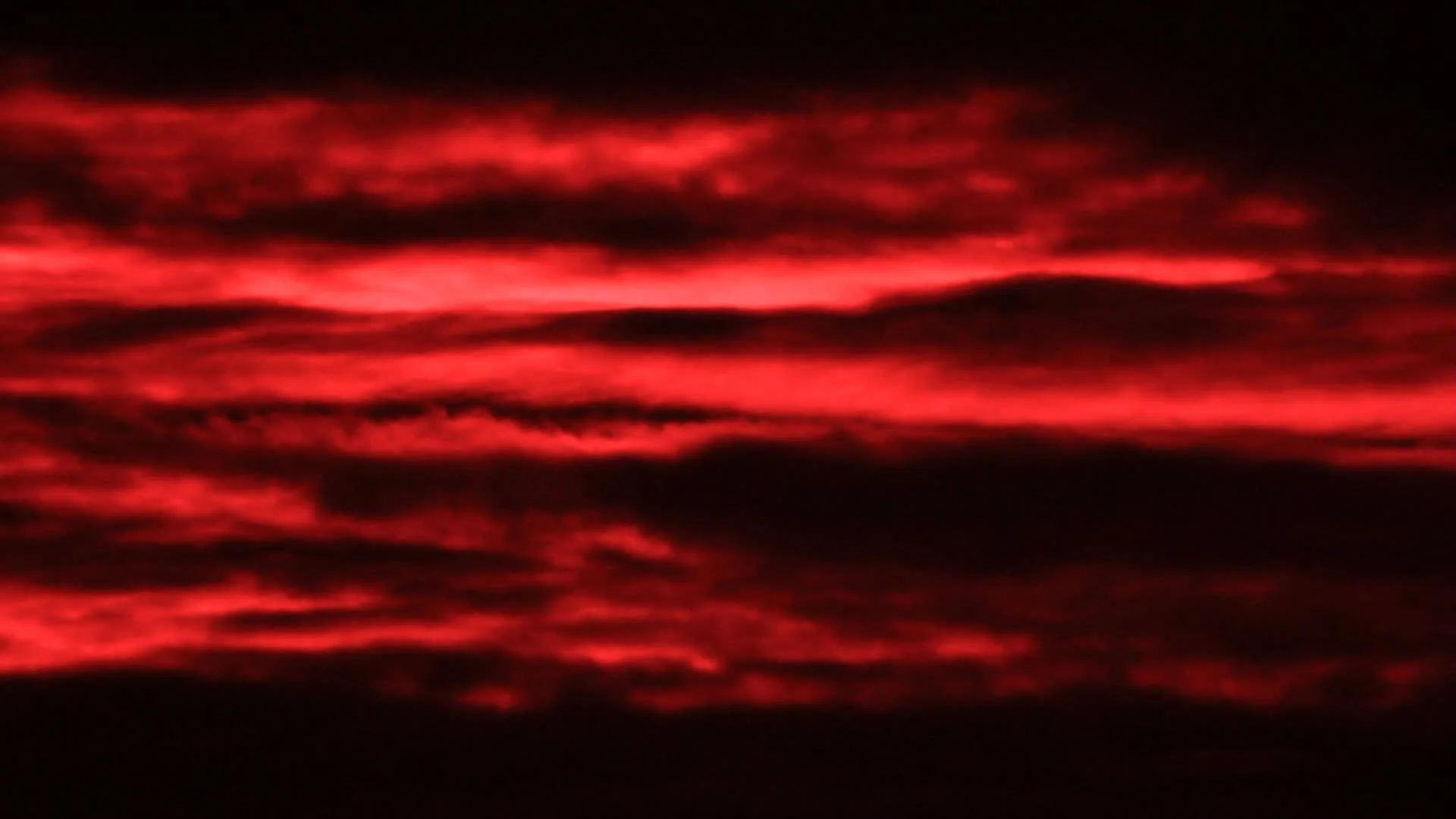 Red clouds on the dark sky