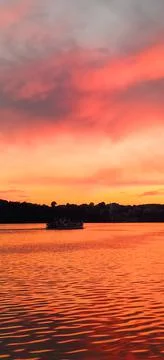 Red clouds on lake Stock Photos