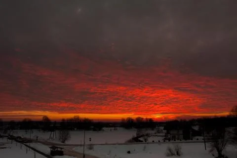 Red clouds lit by sun Stock Photos