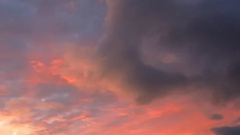 Red clouds in the setting sun run across the dark magnetic sky. Stock Footage 129948587