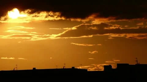 Red clouds in the sky with build on background (timelapse) Stock Footage 10893313