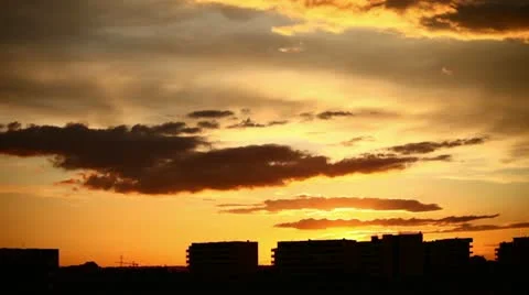 Red clouds in the sky with build on background (timelapse) Stock Footage 10893346
