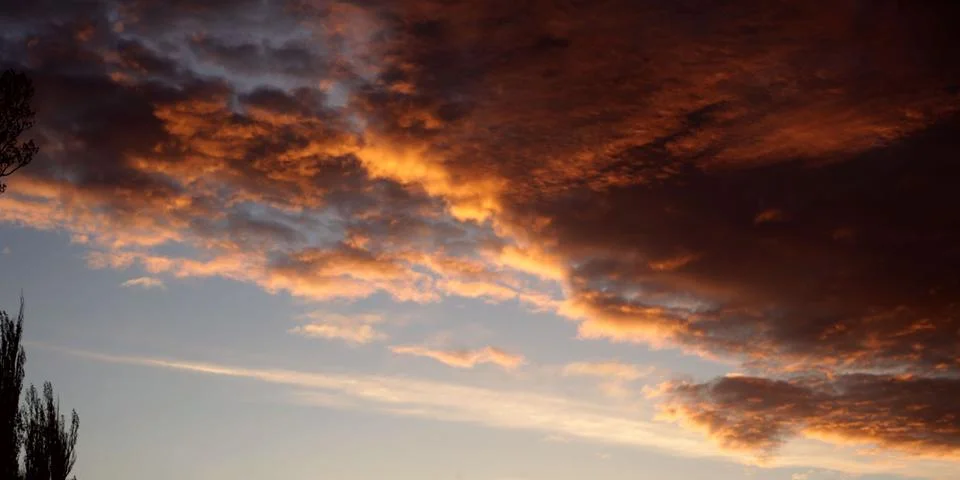 Red clouds at sunset Stock Photos