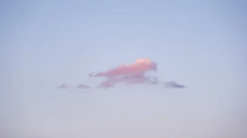Red Clouds Vanishing into a Sky at Sunset (Time Lapse) Stockbeeldmateriaal 148032186