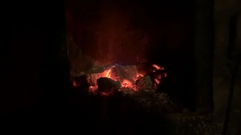 Red coal burns down in the stove of the Russian bath Stockbeeldmateriaal 123795162