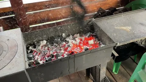 Red coals in the grill and flying ashes Stock Footage 198885553