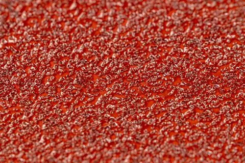 Red coarse-grained sandpaper for working with wood and metal Stock Photos