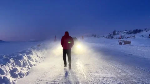Red Coat Approach in Snowy Twilight Stock Footage 256236369