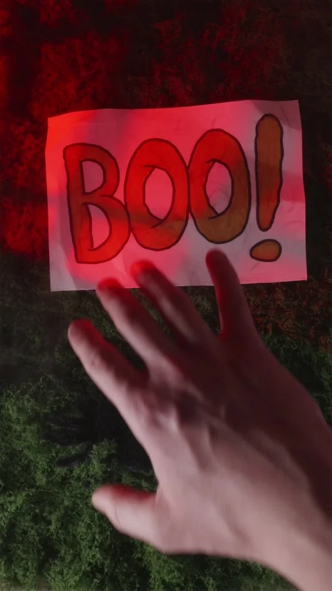 Red cobweb shadow on foggy moss with BOO graphic text Stock Footage 342423385