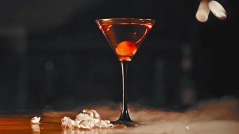 Red cocktail with cherry with smoke Video stock 129437561