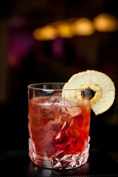Red cocktail on a dark background Stock Photos