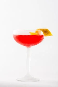 Red cocktail drink with orange shell Stock Photos
