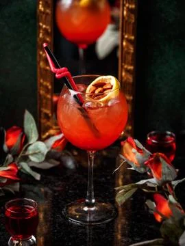 Red cocktail with fruit slice Stock Photos