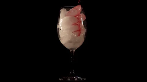 Red cocktail with ice. Close-up Stock Footage 129554392