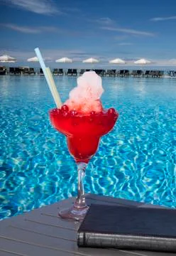 Red cocktail at the pool Stock Photos