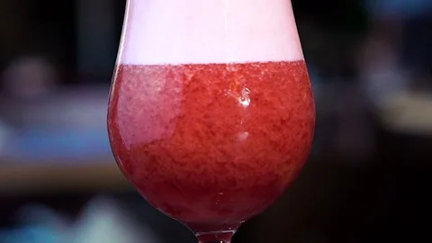 Red cocktail stands on the table Stock Footage 130851975