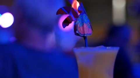 Red cocktail on table on dark background Stock Footage 93863773