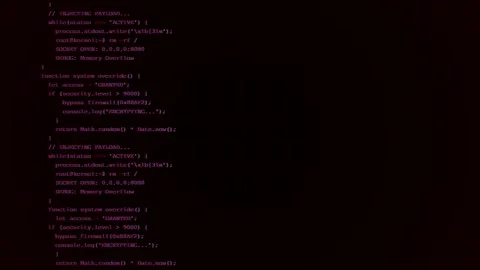 Red code glitch featuring scrolling computer programming script on a dark Stock Footage 345101179