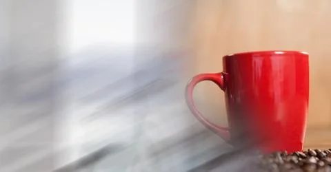 Red coffee cup with beans and blurry white transition Stock Photos